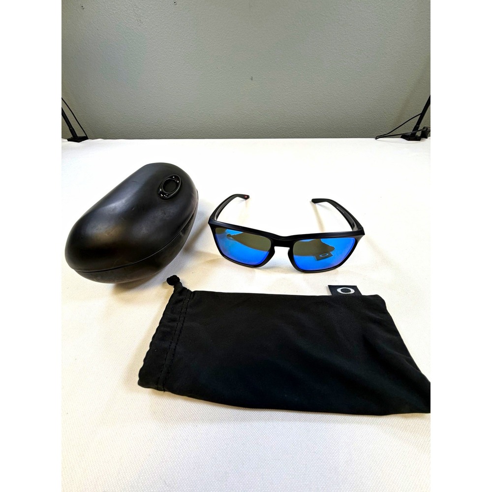 Oakley Sylas OO9448-1257 Polarized Blue Lenses Black Plastic Frame 57-17 142